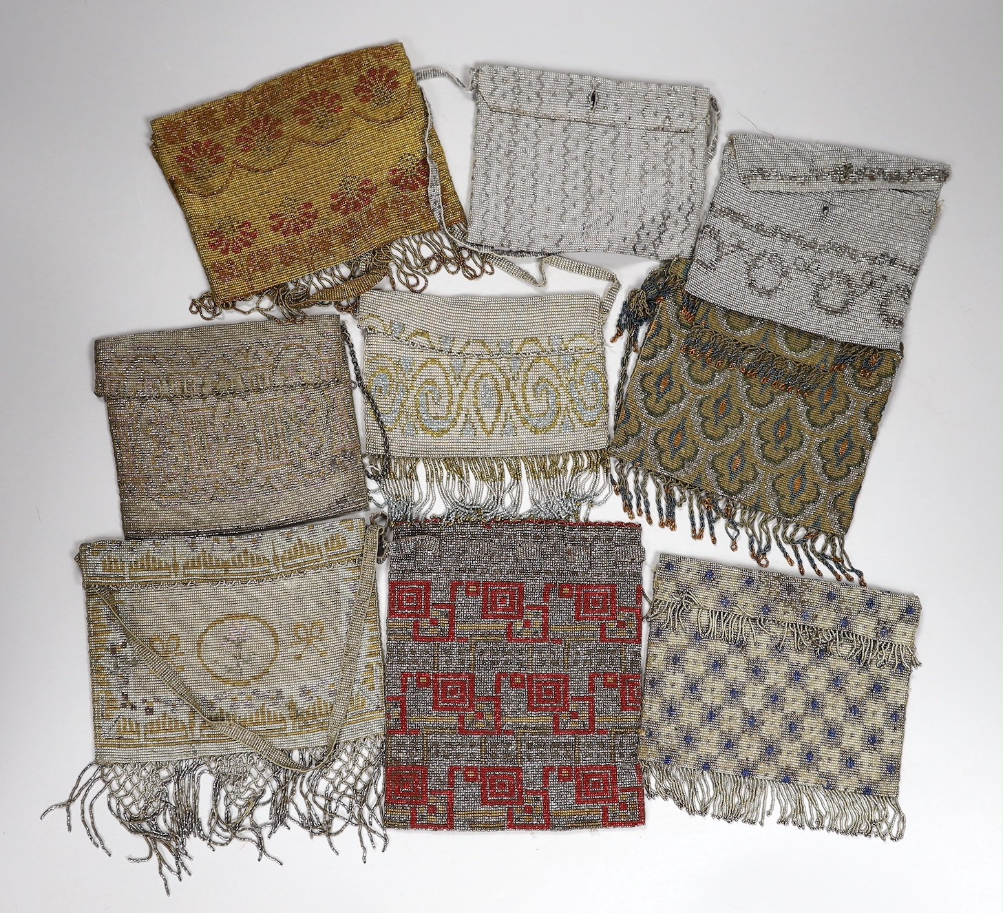 Nine coloured cut steel early 20th century ladies beaded evening bags